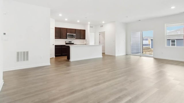 2275 Redwood Trl, Wonder Lake, IL 60097 - unfurnished living room with recessed lighting and light wood-style flooring
