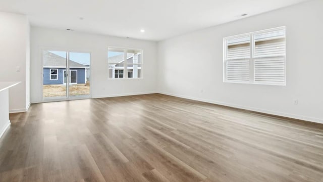 2275 Redwood Trl, Wonder Lake, IL 60097 - unfurnished living room with wood finished floors and recessed lighting