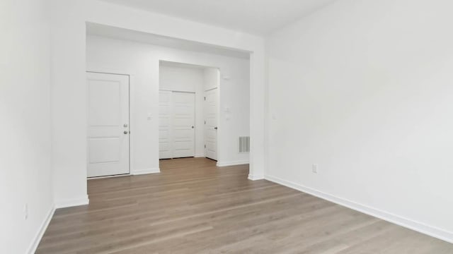 2275 Redwood Trl, Wonder Lake, IL 60097 - unfurnished bedroom with light wood-style flooring and baseboards