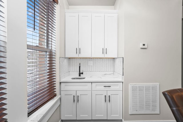 1652 S Ridgeway Ave, Chicago, IL 60623 - bar area featuring a sink and tasteful backsplash