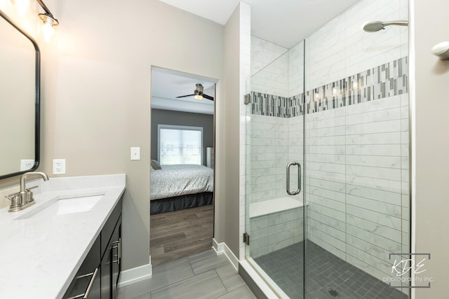 561 Sudbury Cir, Oswego, IL 60543 - ensuite bathroom featuring vanity, a shower stall, and ceiling fan