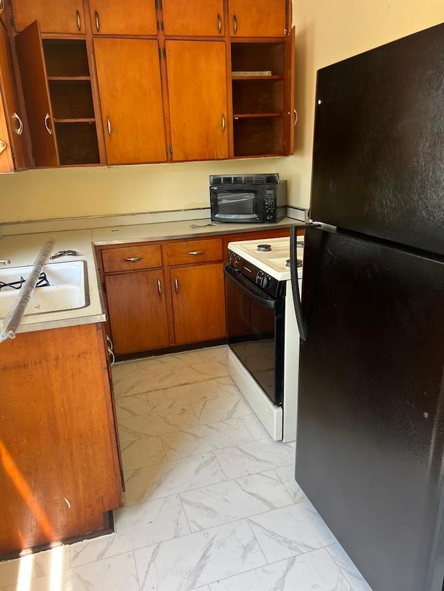 320 W Saint Paul St, Spring Valley, IL 61362 - kitchen with black appliances, open shelves, and light marble finish floors