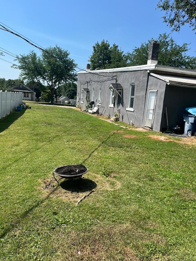 320 W Saint Paul St, Spring Valley, IL 61362 - rear view of property featuring an outdoor fire pit and a chimney