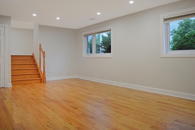 9343 170th Pl, Orland Hills, IL 60487 - empty room with healthy amount of natural light, light wood-type flooring, recessed lighting, and stairway