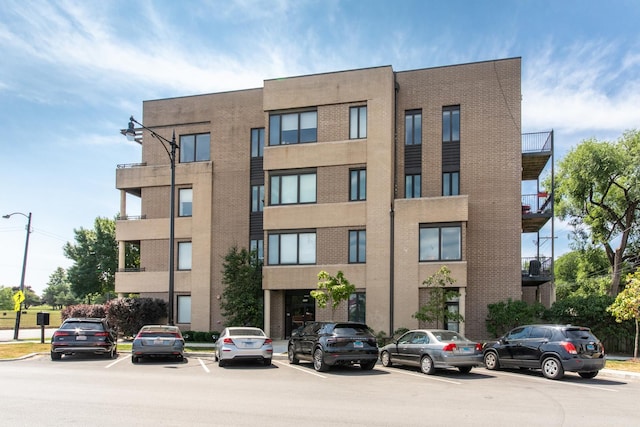 2409 W Catalpa Ave Unit 307, Chicago, IL 60625 - view of building exterior with uncovered parking