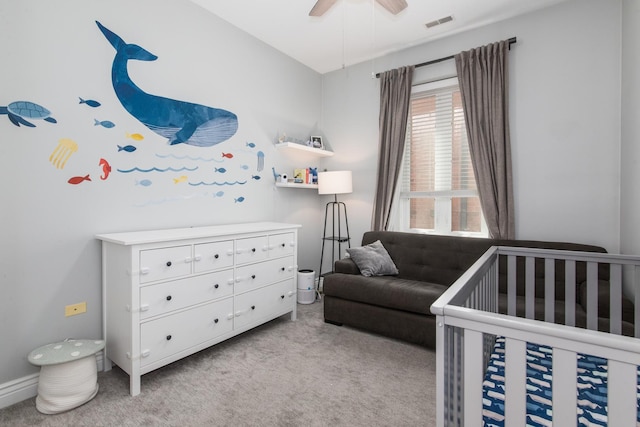 2409 W Catalpa Ave Unit 307, Chicago, IL 60625 - carpeted bedroom with a crib and a ceiling fan
