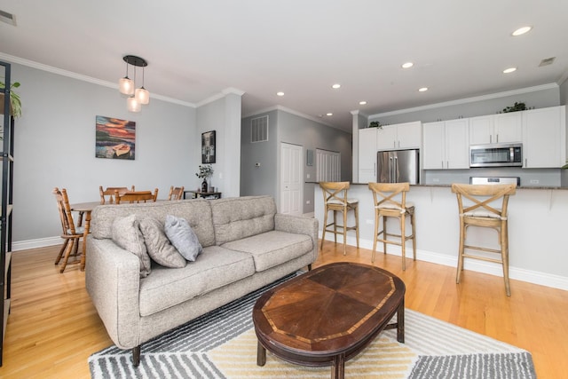 2409 W Catalpa Ave Unit 307, Chicago, IL 60625 - living room featuring ornamental molding, light wood finished floors, and recessed lighting