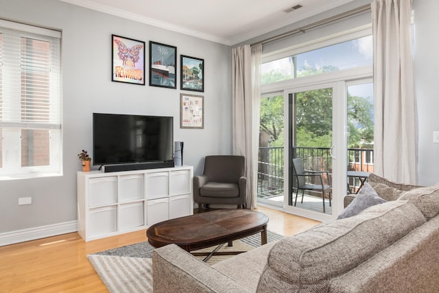 2409 W Catalpa Ave Unit 307, Chicago, IL 60625 - living area with wood finished floors, healthy amount of natural light, and ornamental molding