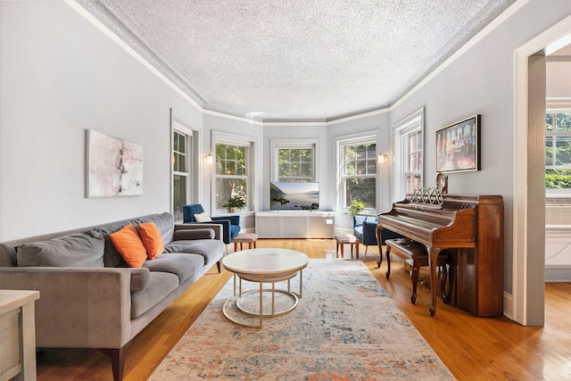 542 W Brompton Ave Unit 1S, Chicago, IL 60657 - sitting room with crown molding, a textured ceiling, and light wood-style floors