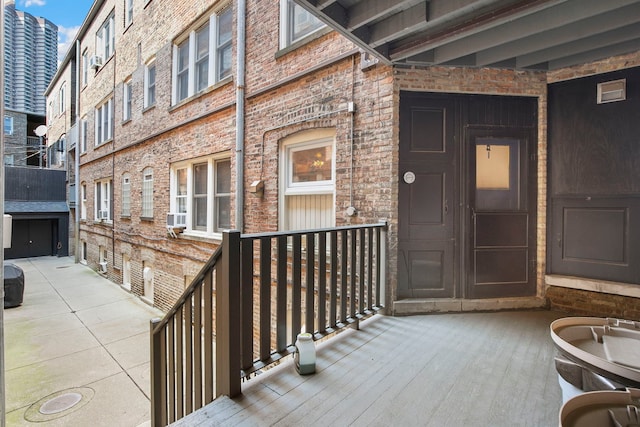 542 W Brompton Ave Unit 1S, Chicago, IL 60657 - property entrance featuring brick siding and cooling unit