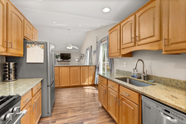 2408 Danbury Dr Unit A2, Woodridge, IL 60517 - kitchen featuring stainless steel appliances, vaulted ceiling, light wood finished floors, light stone countertops, and ceiling fan