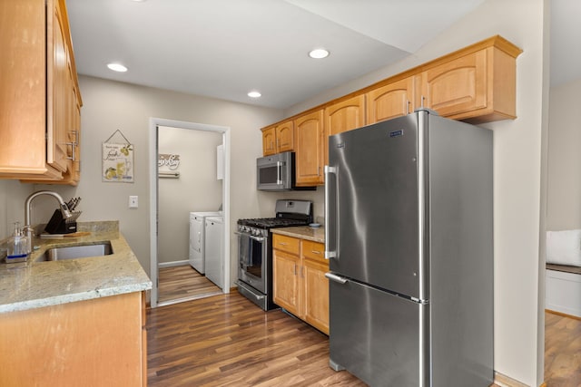2408 Danbury Dr Unit A2, Woodridge, IL 60517 - kitchen with stainless steel appliances, separate washer and dryer, wood finished floors, light stone counters, and recessed lighting