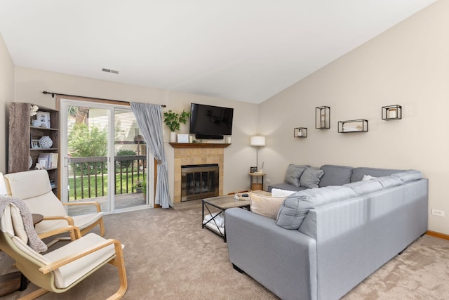 2408 Danbury Dr Unit A2, Woodridge, IL 60517 - living room featuring light carpet, a tiled fireplace, and lofted ceiling