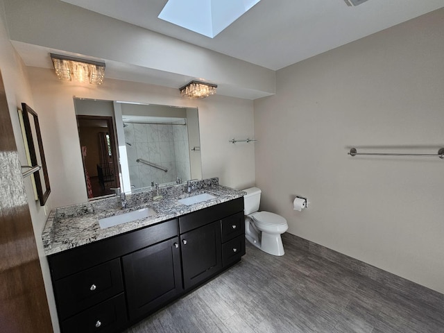 7215 Beckwith Rd, Morton Grove, IL 60053 - bathroom featuring a skylight, a tile shower, and double vanity