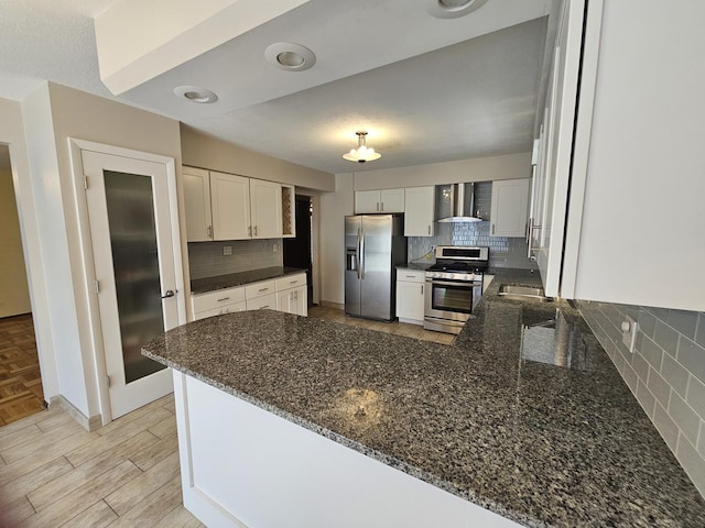 7215 Beckwith Rd, Morton Grove, IL 60053 - kitchen with stainless steel appliances, wall chimney exhaust hood, tasteful backsplash, and dark stone countertops