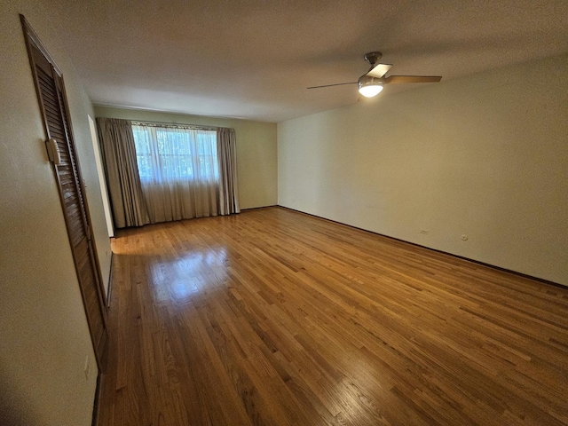 7215 Beckwith Rd, Morton Grove, IL 60053 - unfurnished room with wood finished floors and a ceiling fan