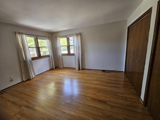 7215 Beckwith Rd, Morton Grove, IL 60053 - unfurnished bedroom featuring wood finished floors and a closet