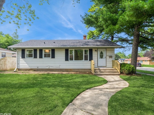 2402 Marshall Pkwy, Waukegan, IL 60085 - view of front facade featuring a chimney and a shingled roof