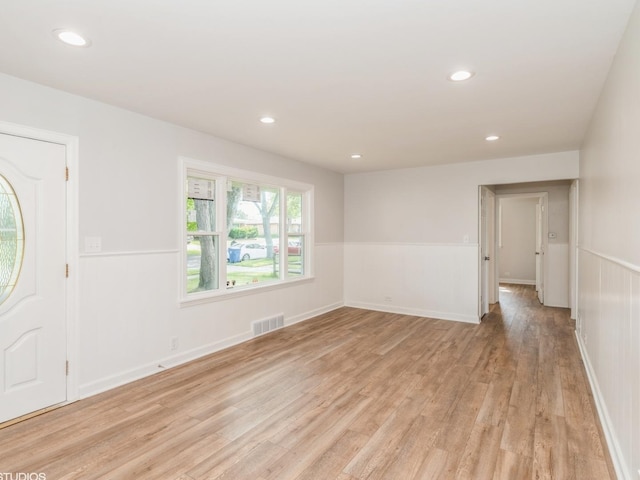 2402 Marshall Pkwy, Waukegan, IL 60085 - foyer with light wood-type flooring, recessed lighting, and a wainscoted wall