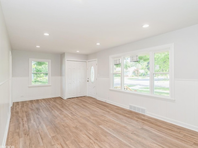 2402 Marshall Pkwy, Waukegan, IL 60085 - spare room featuring light wood finished floors, a wainscoted wall, and recessed lighting
