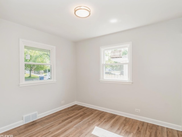 2402 Marshall Pkwy, Waukegan, IL 60085 - spare room with plenty of natural light and light wood finished floors