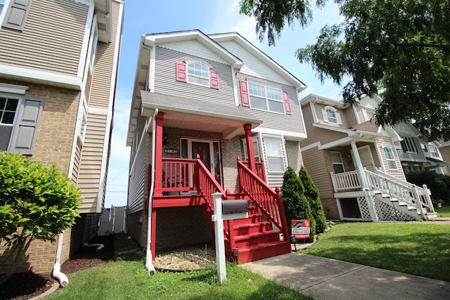 6142 W 60th St, Chicago, IL 60638 - view of front of home featuring stairs, a porch, brick siding, and a front lawn