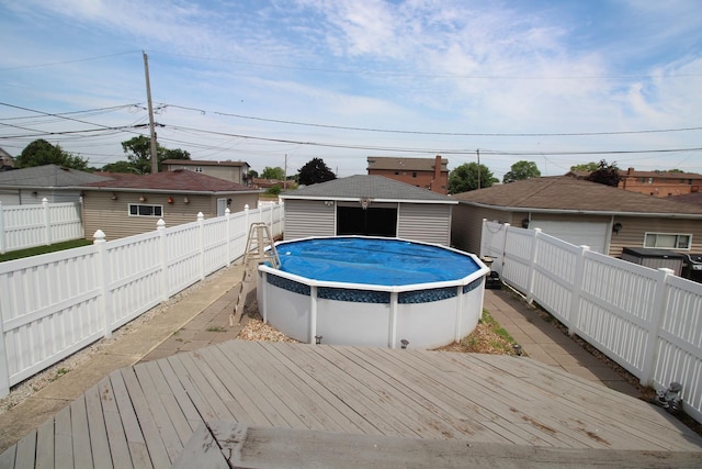 6142 W 60th St, Chicago, IL 60638 - deck with a fenced backyard, a detached garage, and an outdoor structure