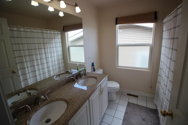 6142 W 60th St, Chicago, IL 60638 - bathroom with double vanity and tile patterned floors