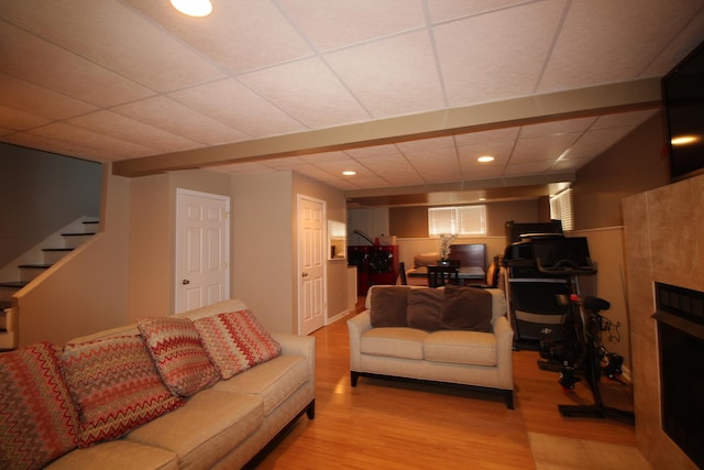 6142 W 60th St, Chicago, IL 60638 - living room featuring wood finished floors, a drop ceiling, stairway, recessed lighting, and a fireplace