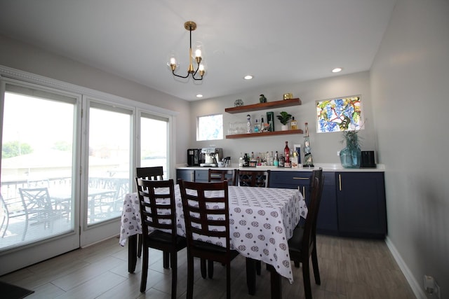 6142 W 60th St, Chicago, IL 60638 - dining room with bar area, a chandelier, recessed lighting, and light wood-type flooring