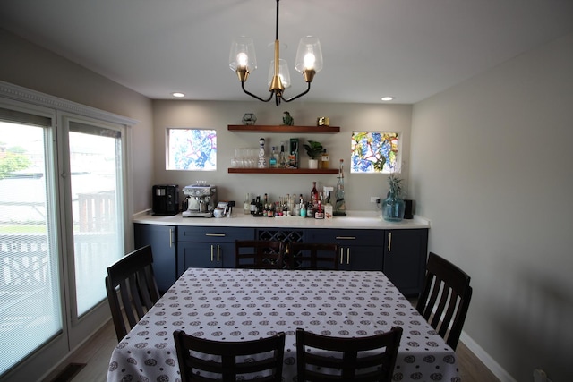 6142 W 60th St, Chicago, IL 60638 - dining space featuring a dry bar, a chandelier, wood finished floors, and recessed lighting