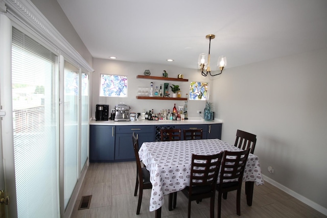 6142 W 60th St, Chicago, IL 60638 - dining room featuring a chandelier, recessed lighting, and light wood finished floors