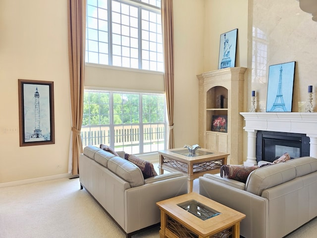 4 Forest View Dr, Hawthorn Woods, IL 60047 - living area with a high ceiling, a glass covered fireplace, and light carpet