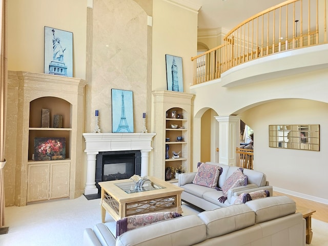 4 Forest View Dr, Hawthorn Woods, IL 60047 - living room with a towering ceiling, arched walkways, a glass covered fireplace, built in features, and ornate columns