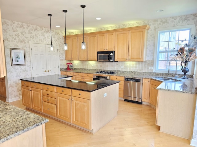 4 Forest View Dr, Hawthorn Woods, IL 60047 - kitchen with appliances with stainless steel finishes, light brown cabinets, light wood-style floors, wallpapered walls, and dark stone counters