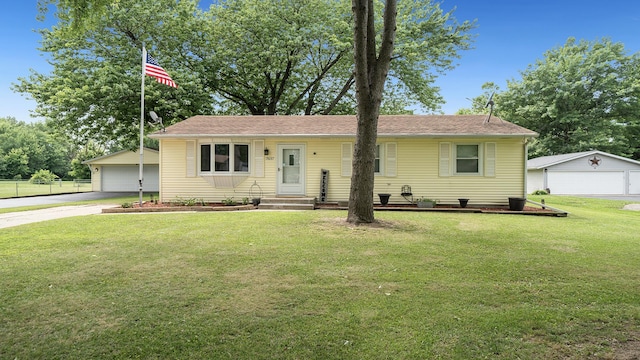 7837 Wagon Wheel Ln, Rockford, IL 61109 - ranch-style home featuring an outbuilding and a detached garage