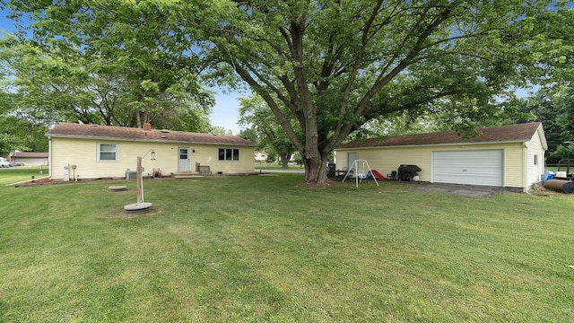 7837 Wagon Wheel Ln, Rockford, IL 61109 - view of green lawn with a garage and an outdoor structure