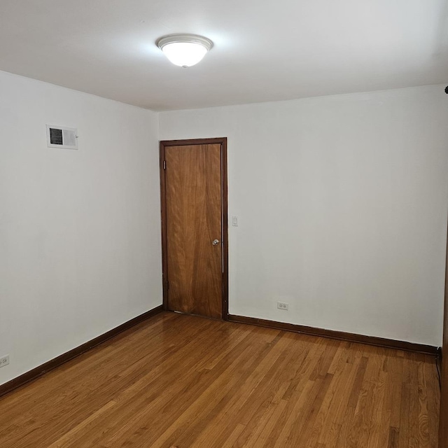5823 W Addison St, Chicago, IL 60634 - unfurnished room with light wood-style floors