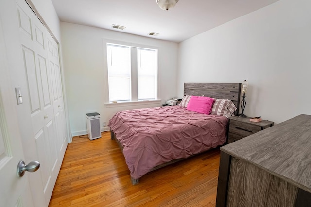 3043 N Laramie Ave Unit 2, Chicago, IL 60641 - bedroom featuring a closet and light wood-type flooring