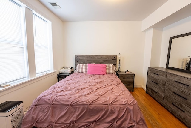 3043 N Laramie Ave Unit 2, Chicago, IL 60641 - bedroom with light wood-style floors and baseboards