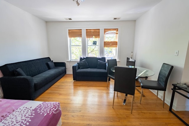 3043 N Laramie Ave Unit 2, Chicago, IL 60641 - living room featuring light wood finished floors