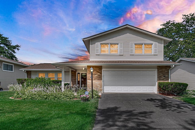 2716 Turtle Creek Dr, Hazel Crest, IL 60429 - traditional home featuring brick siding, a garage, asphalt driveway, a front lawn, and a shingled roof