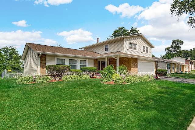 2716 Turtle Creek Dr, Hazel Crest, IL 60429 - traditional-style home featuring brick siding, an attached garage, and driveway