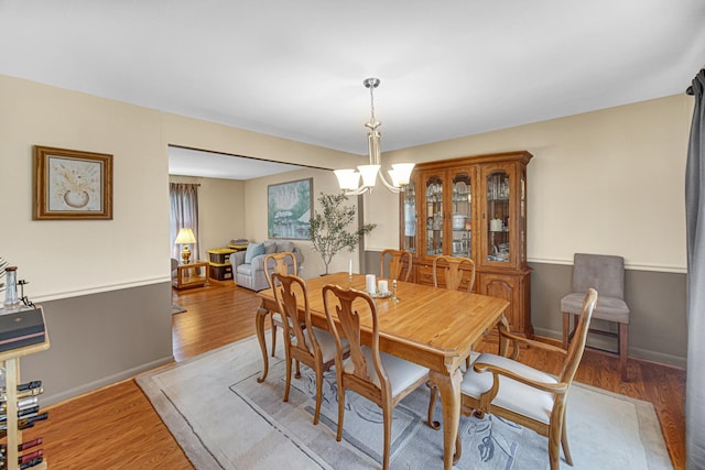 2716 Turtle Creek Dr, Hazel Crest, IL 60429 - dining space featuring a chandelier and light wood-style flooring