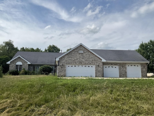 6130 N Jeffrey Ln, Oregon, IL 61061 - single story home featuring brick siding, an attached garage, driveway, and roof with shingles