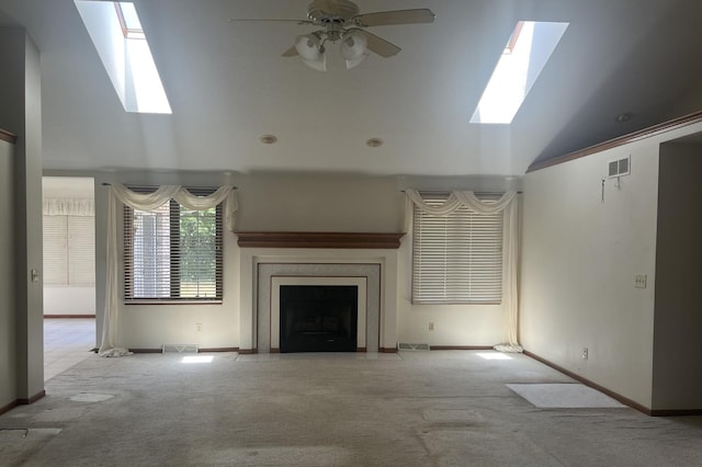 6130 N Jeffrey Ln, Oregon, IL 61061 - unfurnished living room with a skylight, carpet, lofted ceiling, a ceiling fan, and a fireplace with flush hearth