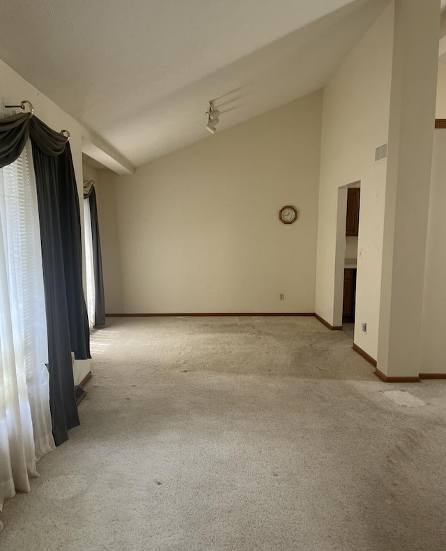 6130 N Jeffrey Ln, Oregon, IL 61061 - empty room featuring light colored carpet and vaulted ceiling