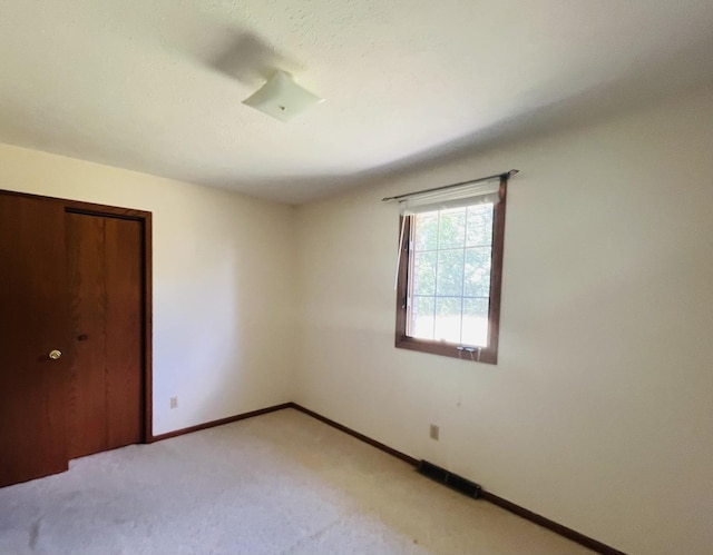 6130 N Jeffrey Ln, Oregon, IL 61061 - unfurnished bedroom with light colored carpet and a closet