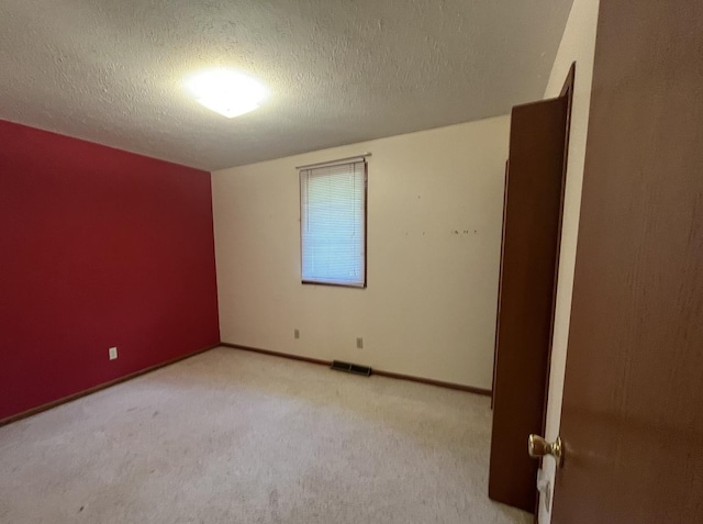 6130 N Jeffrey Ln, Oregon, IL 61061 - carpeted empty room featuring a textured ceiling and baseboards