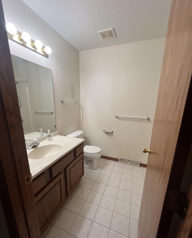 6130 N Jeffrey Ln, Oregon, IL 61061 - bathroom featuring tile patterned flooring, vanity, and a textured ceiling